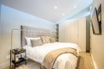 Top Floor Master Bedroom with King Bed. Features en-suite Bathroom, TV & Cabinet
